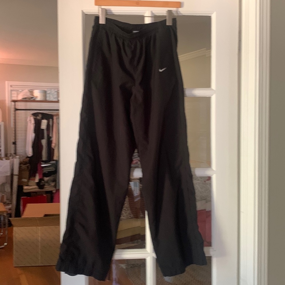 Nike Women’s High Rise Track Pants with Zip-Open Side Slits and Pockets